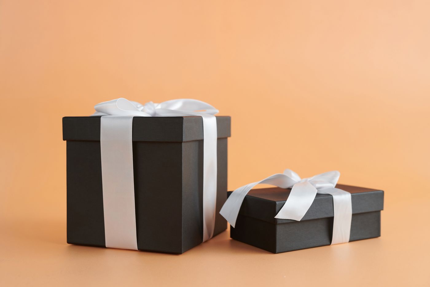 Black rigid gift boxes with satin ribbons