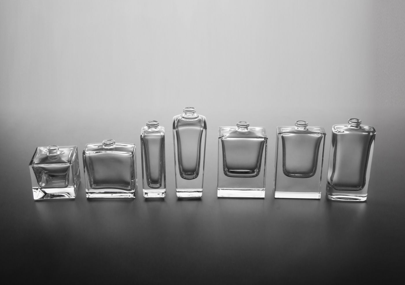 Row of empty glass perfume bottles